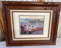 Framed print showing overall framed artwork with carved wooden frame and cream matting.