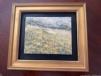 Framed textured oil painting showing landscape with mountains and fields in impressionistic style