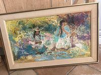 Framed oil painting showing abstract impressionist style with two female figures in white dresses amidst vibrant colors.