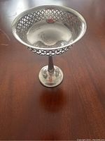 Tall pedestal compote candy dish with pierced lattice sides and round base