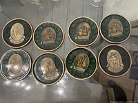 Set of 8 round golf-themed coasters with textured green and metallic central golf designs