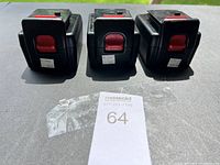 Front view of 3 black POWER-PRO lithium ion batteries lined side by side with red release button visible.