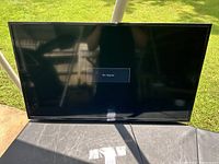 Front view of the 40-inch flat screen TV powered on showing 'No Signal' message.