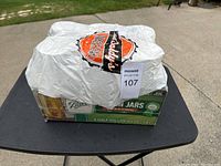 Top view of sealed box wrapped in plastic with sale tag