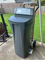 Front view of gray Whirlpool Pro Series water softener unit with digital control head