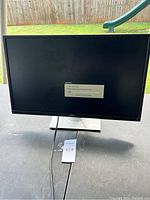 Front view of Dell monitor powered on with Windows update display.