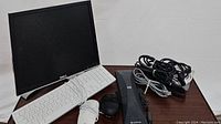 Photo showing all items together: Dell monitor, white keyboard, two black mice, black HP Scanjet scanner, and various cables coiled.