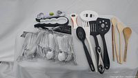 Full view of the lot arranged on a white surface showing all utensils and cutlery packs.