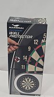 Front view of original box showing Narwhal branding and dartboard wall protector usage illustration