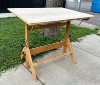 Full view of drafting table showing ash wood top and A-frame base