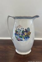 Full side view of the vintage porcelain vase showing the Asian-inspired painted scene and handle