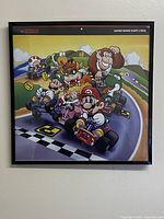 Front view of framed square art showing Super Mario Kart characters racing.