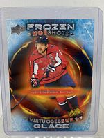 Close-up of the Alex Ovechkin Frozen Hot Shots hockey card in protective sleeve showing design details and player image.