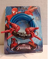 Front packaging showing the Spiderman themed bike lock with 4ft cable coiled and Spiderman hands on the combination lock.