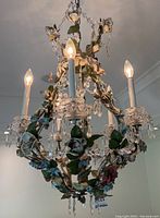 Overall front view of chandelier with lights on