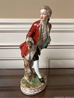 Front full-body view of the gentleman figure showing pose, attire and base