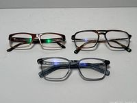 Overview of three eyeglass frames on white background