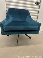 Front view of lounge chair showing seat cushion and backrest