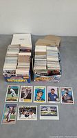 Two boxes containing over 800 baseball cards arranged neatly, showing front and side views of stacks.