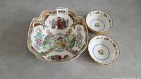 Overview photo showing large Chinese art bowl and two smaller bowls with artwork and gold trim.