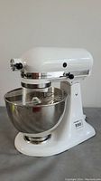 Front view of white KitchenAid mixer with bowl attached