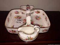Front perspective of Hammersley China server tray showing floral design, gold accents, handle, and attached cream and sugar dishes.