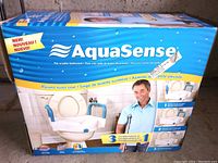 Box of AquaSense raised toilet seat with image of product and branding