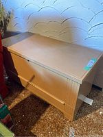 Front and side view of Honderich Red Seal cedar hope chest closed showing finish and size.