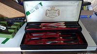 Set of carving knives and fork in original box with satin interior and Gold Crown logo