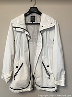 Front view of Creenstone zip-up hooded jacket open to show mesh lining