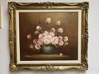 Full frontal view of painting and ornate frame