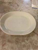 White oval Corelle platter shown from top, plain design