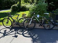 Both bicycles side by side outdoors on paved surface