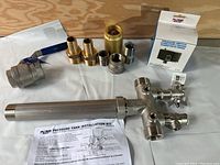 Image showing the entire kit laid out including manifold, valves, brass fittings, and pressure switch.
