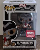 Front view of the Funko Pop box showing figure in package, character name El Venenoide, number 707, and Marvel Collector Corps exclusive sticker.