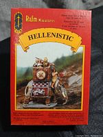 Box front showing Rafm Miniatures branding, Hellenistic title, and image of assembled and painted metal miniature figure with mounted soldier.