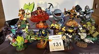 Front view of all sixteen Skylanders figures arranged in rows showing variety and detail.