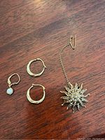 All four pieces on wood surface