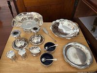 Overview of all sterling silver servingware on table