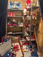Four metal utility shelves in basement closets with seasonal decorations and boxes stored on them for display. Shelves empty per seller description.