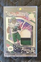 Front of Michael Carter rookie card showing player image, Supercharged design, Jets logo, and jersey patch.