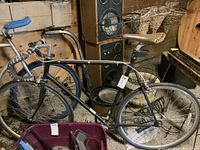 Side profile of the vintage bicycle showing the full frame, wheels, and handlebars.