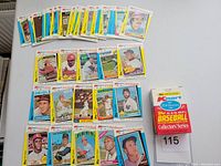 Overview of the full set of 1982 Topps Kmart 20th Anniversary baseball MVP cards laid out with the original box showing the collection count and branding.