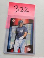Front photo of 2014 Bowman Scout's Breakout Aaron Judge baseball card in protective plastic sleeve with pink label '322'