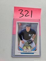 Front of Aaron Judge 2014 Bowman Top Prospects baseball card in a protective sleeve with pink lot number tag behind it.