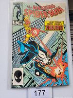 Front cover of Amazing Spiderman #269 comic book showing Spiderman in black suit and Firelord.
