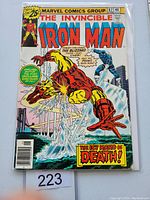 Front cover photo of Iron Man #87 comic showing Iron Man fighting Blizzard with action text captions and comic pricing details.