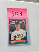 Front view of the 1986 Donruss Mark McGwire rookie baseball card, showing player image and card number 309.