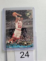 Front view of Michael Jordan Stadium Club basketball card in plastic sleeve showing Jordan dunking in Chicago Bulls uniform