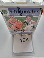 Front view of sealed box showing artwork and branding for 2022 Panini Chronicles Draft Picks basketball cards highlighting 20 cards inside.